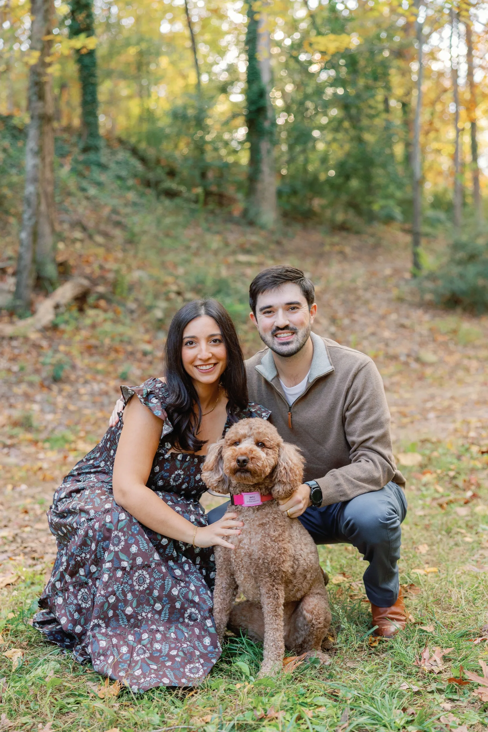 Dr. Arianna Cole and Dr. David Cole with their mini goldendoodle, Maple.